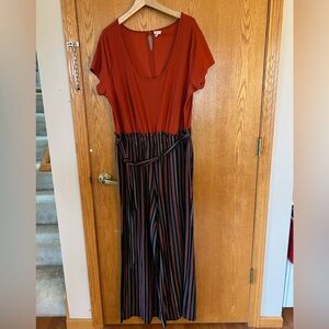 Orange and black short sleeved pants romper size 2x.